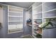 Walk-in closet with custom shelving, and ample storage space at 2174 62Nd N St, Clearwater, FL 33760