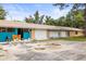 Exterior view of the home featuring multiple garages in a quiet neighborhood and inviting curb appeal at 2174 62Nd N St, Clearwater, FL 33760