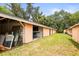 A view of the rear yard with lots of storage units at 2174 62Nd N St, Clearwater, FL 33760