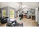 Open-concept kitchen with gray cabinets, vaulted ceilings, and a view to the backyard at 2174 62Nd N St, Clearwater, FL 33760