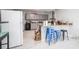 Open-concept kitchen with bar seating and views of the living room at 2174 62Nd N St, Clearwater, FL 33760