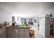 Open-concept kitchen featuring granite countertops, stainless steel appliances, and view into the living area at 2174 62Nd N St, Clearwater, FL 33760