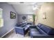 Living room featuring vaulted ceilings, two sofas, and views to the exterior at 2174 62Nd N St, Clearwater, FL 33760