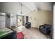 Living room with vaulted ceilings, a door to backyard, and black leather chairs at 2174 62Nd N St, Clearwater, FL 33760