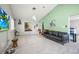 Expansive living room with tile flooring, vaulted ceilings, and a comfortable leather sofa at 2174 62Nd N St, Clearwater, FL 33760