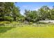 Picturesque pond with lush landscaping and serene waterfall feature, creating a tranquil outdoor oasis at 2174 62Nd N St, Clearwater, FL 33760