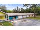 Side view of a house and garage unit with multiple parking spots at 2174 62Nd N St, Clearwater, FL 33760