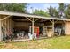 Outdoor storage shed filled with debris, tools, and ladders at 2174 62Nd N St, Clearwater, FL 33760