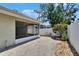 Paver patio features access to the screened back porch, plus a fenced yard at 2527 Wrencrest Cir, Valrico, FL 33594