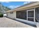 Paver patio features access to the screened back porch of the house at 2527 Wrencrest Cir, Valrico, FL 33594