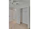 Carpeted bedroom showing a closet and entry door at 2527 Wrencrest Cir, Valrico, FL 33594