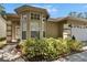 Charming exterior elevation with bay window and well-maintained landscaping at 2527 Wrencrest Cir, Valrico, FL 33594