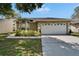 Charming single-story home featuring a well-maintained lawn and a spacious two-car garage at 2527 Wrencrest Cir, Valrico, FL 33594