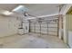 Spacious two car garage featuring storage cabinets and clean floors at 2527 Wrencrest Cir, Valrico, FL 33594