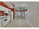 Bright eat-in kitchen with a bay window, tile floors, and white appliances for a cozy space at 2527 Wrencrest Cir, Valrico, FL 33594
