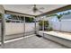 Screened back porch features a ceiling fan and a view of the yard at 2527 Wrencrest Cir, Valrico, FL 33594