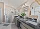 Bathroom with double sinks, a modern glass shower, and stylish fixtures at 31201 Shaker Cir, Wesley Chapel, FL 33543