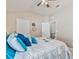 Bedroom featuring a bed with blue floral pattern and two white doors at 31201 Shaker Cir, Wesley Chapel, FL 33543
