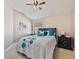 Bedroom featuring a cozy bed, accent pillows, and natural light at 31201 Shaker Cir, Wesley Chapel, FL 33543