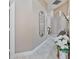 Bright hallway features lovely floors, neutral paint, and decorative elements at 31201 Shaker Cir, Wesley Chapel, FL 33543