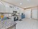 Well-appointed kitchen featuring granite countertops, stainless steel appliances, and ample storage space at 31201 Shaker Cir, Wesley Chapel, FL 33543