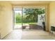 Enclosed patio with open view of lush backyard at 31201 Shaker Cir, Wesley Chapel, FL 33543