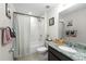 Clean bathroom with a shower-tub combination, vanity, and coordinated decor at 32718 Harmony Oaks Dr, Wesley Chapel, FL 33545