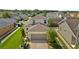 Charming two-story home boasts a well-manicured lawn and attached two-car garage in a neatly organized residential area at 32718 Harmony Oaks Dr, Wesley Chapel, FL 33545