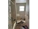Bathroom showing shower, toilet and vanity in a state of disrepair at 3311 W Saint Conrad St, Tampa, FL 33607
