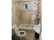 A bathroom featuring a toilet, sink, and shower in poor condition at 3311 W Saint Conrad St, Tampa, FL 33607