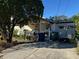 Single story home's front view featuring a small porch and front yard with an array of items at 3311 W Saint Conrad St, Tampa, FL 33607