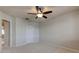 Neutral bedroom with a carpet flooring, ceiling fan with light, and closet at 3322 Cypress Landing Dr, Valrico, FL 33596