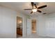 Neutral bedroom with ensuite bathroom vanity with sink and doorway views at 3322 Cypress Landing Dr, Valrico, FL 33596