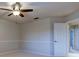 A bedroom with carpeted floors, a ceiling fan, and trim that accents the walls, adding character at 3322 Cypress Landing Dr, Valrico, FL 33596