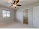 Bright bedroom with carpet flooring, a window and view, with light neutral walls at 3322 Cypress Landing Dr, Valrico, FL 33596