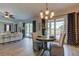 Elegant dining area with views of the pool, stylish decor, and modern lighting at 3322 Cypress Landing Dr, Valrico, FL 33596