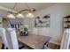 Dining room with a decorative centerpiece, modern art, and an elegant light fixture at 3322 Cypress Landing Dr, Valrico, FL 33596