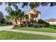 Beautiful two-story home with a well-kept lawn and mature landscaping at 3322 Cypress Landing Dr, Valrico, FL 33596