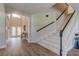 Grand foyer featuring a staircase, high ceilings, and elegant entry table with decor at 3322 Cypress Landing Dr, Valrico, FL 33596