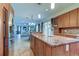 Open-concept kitchen features a large island with granite countertop and modern cabinetry at 3322 Cypress Landing Dr, Valrico, FL 33596