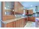 Well-appointed kitchen with granite countertops, modern fixtures, and ample storage space at 3322 Cypress Landing Dr, Valrico, FL 33596