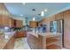 Spacious kitchen featuring stainless steel appliances, granite countertops, and custom cabinetry at 3322 Cypress Landing Dr, Valrico, FL 33596