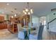 View of living and dining areas, showcasing the open layout and kitchen access at 3322 Cypress Landing Dr, Valrico, FL 33596