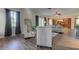 Open-concept living room with sleek furnishings, stylish decor, and hardwood floors at 3322 Cypress Landing Dr, Valrico, FL 33596