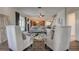 Bright living room with stylish seating, modern decor, and open flow to the dining area at 3322 Cypress Landing Dr, Valrico, FL 33596
