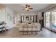 Bright living room with wood floors, neutral furniture, and access to the outdoor area at 3322 Cypress Landing Dr, Valrico, FL 33596