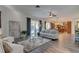 Inviting living room with a cozy seating area, hardwood floors, and access to outdoor views at 3322 Cypress Landing Dr, Valrico, FL 33596
