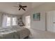 Bright main bedroom showcasing a private balcony and a tranquil, minimalist design at 3322 Cypress Landing Dr, Valrico, FL 33596