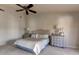 Serene bedroom featuring a ceiling fan, calming color palette, and stylish furnishings at 3322 Cypress Landing Dr, Valrico, FL 33596