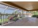 Spacious screened lanai boasts views of the lush landscaping and tranquil lake at 3322 Cypress Landing Dr, Valrico, FL 33596
